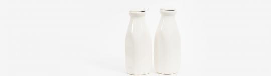 White milk bottles with a white background